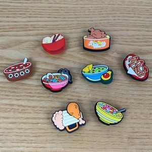 8 different bowls of food, croc charms